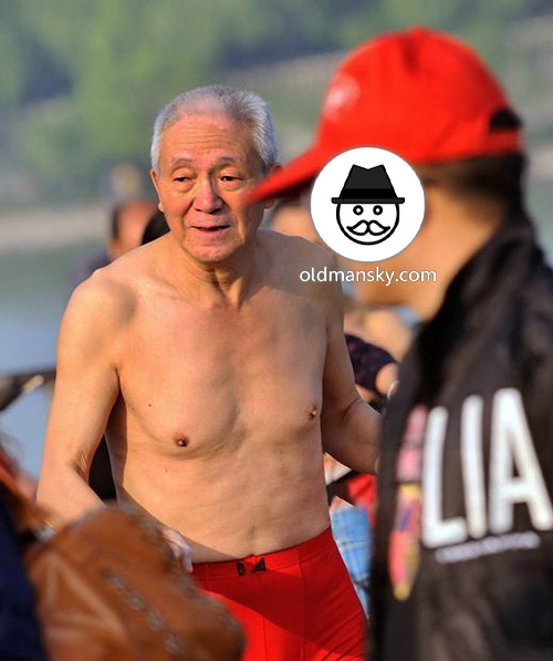 White hair old man wore a red underwear went swimming by the river