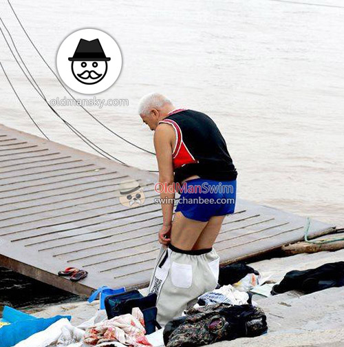 White hair old man in a brown underwear went swimming by the river