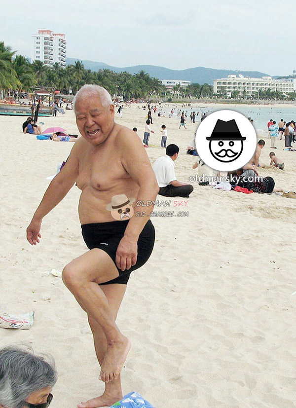 White hair old man wore blue beach pants stood at the sea_03