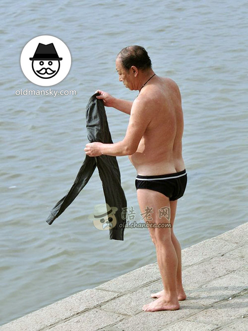 Old daddy wore a black underwear ready to swim stand by the river