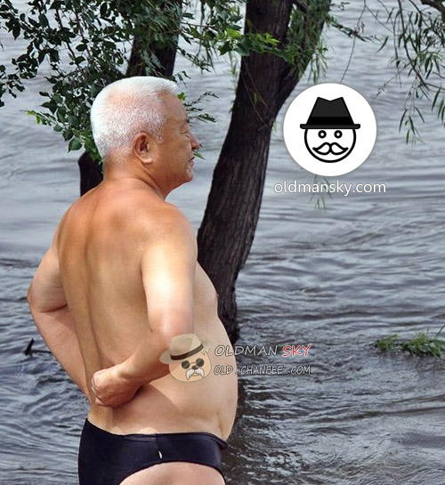 White short hair swimming old man wore a black underwear by the lake